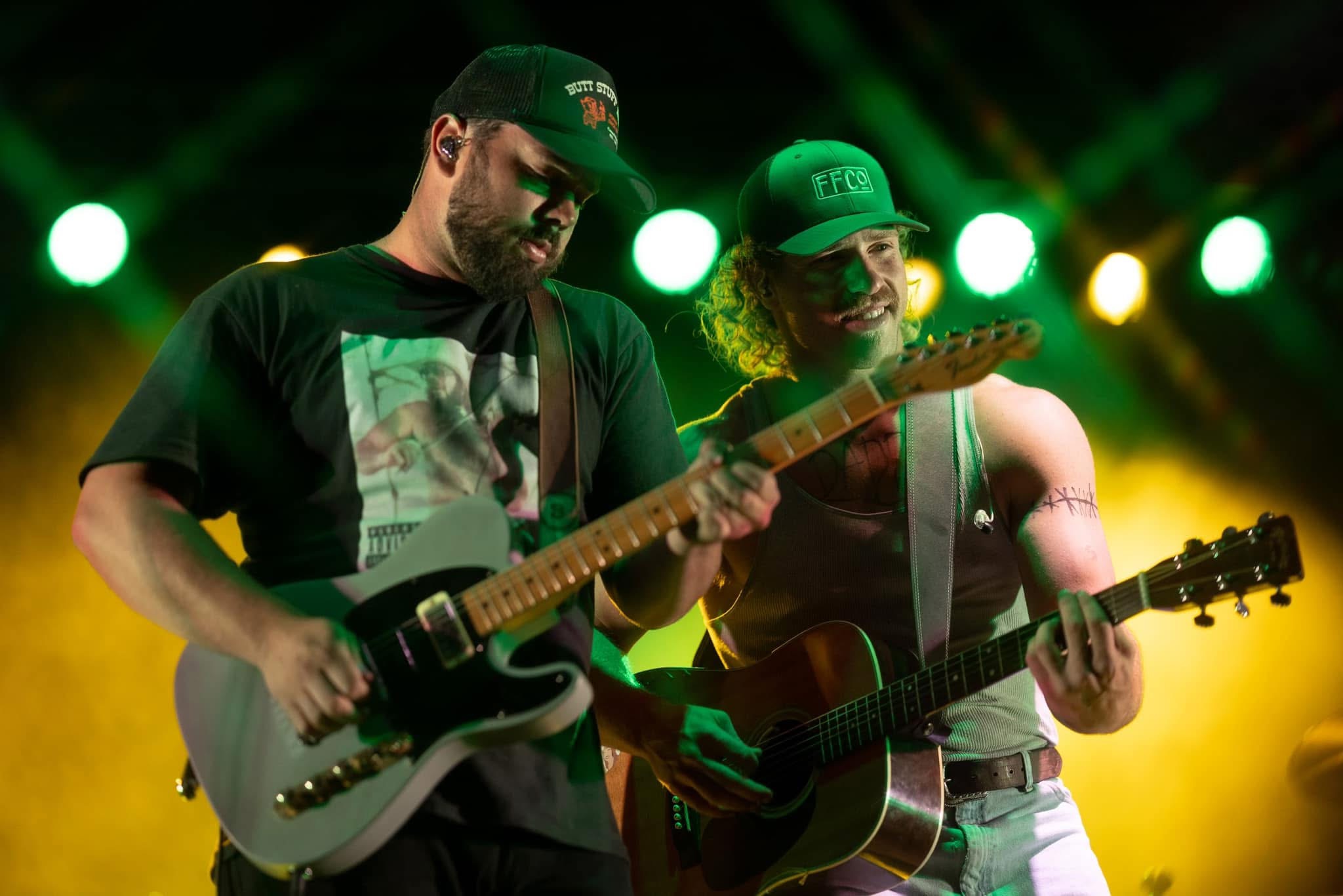 Will and Reid Shackelford performing together on stage, 2024
