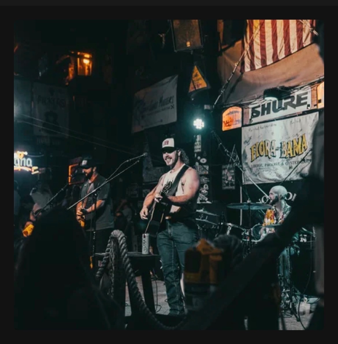 Shackelford Lane live at Flora-Bama with crowd in the foreground