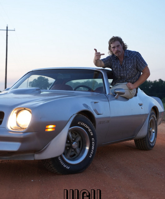 Reid Shackelford with a vintage Trans Am